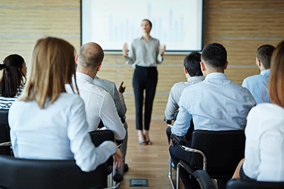 Facilitator leading a training session with multiple participants